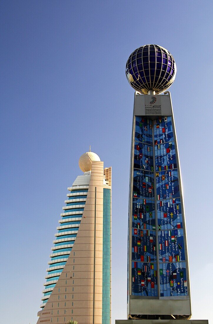 Etisalat Tower, Office building of Emirates Telecommunications Corporation, left, right monument to celebrate the hosting of the Annual Meetings of the Board of Governors of the World Bank and the International Monetary Fund, Dubai, United Arab Emirates