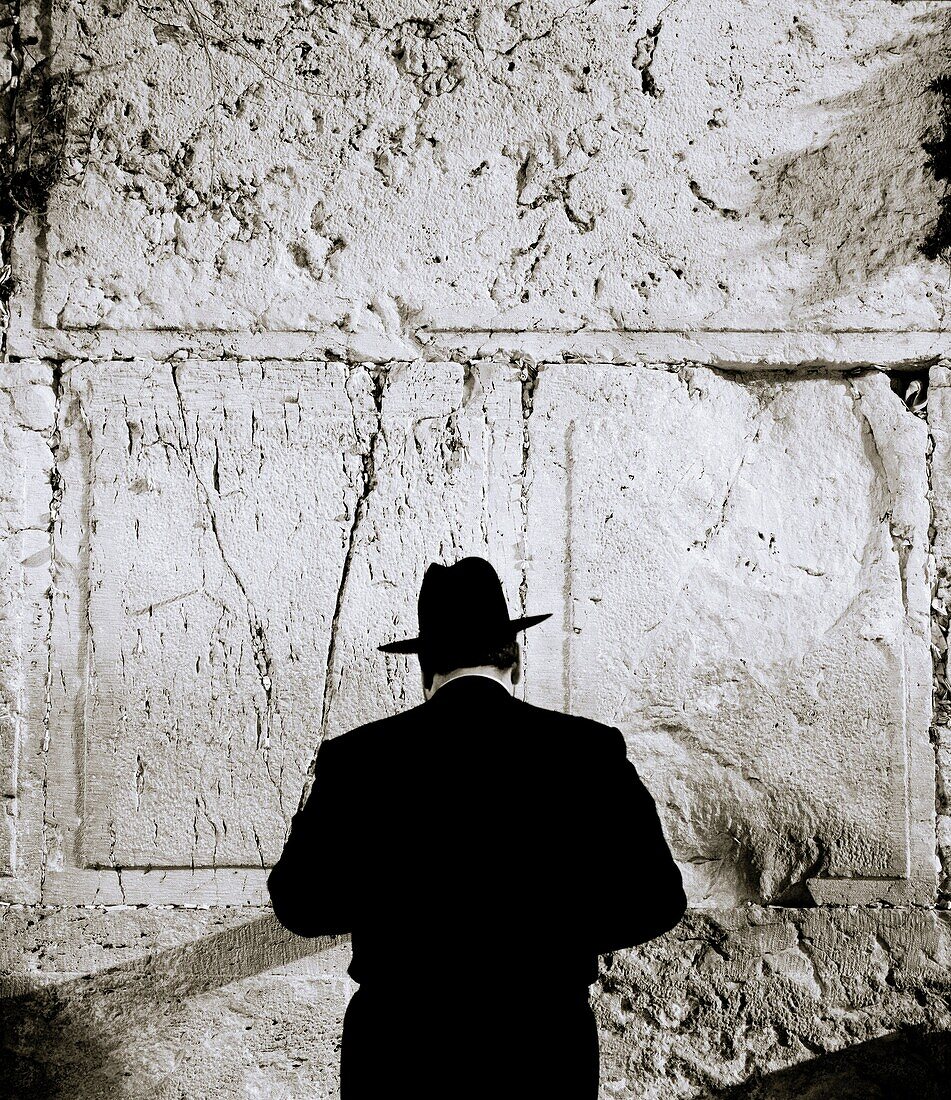 An Orthodox Jewish man conducts his prayers at the Wailing Wall, in Jerusalem, Israel
