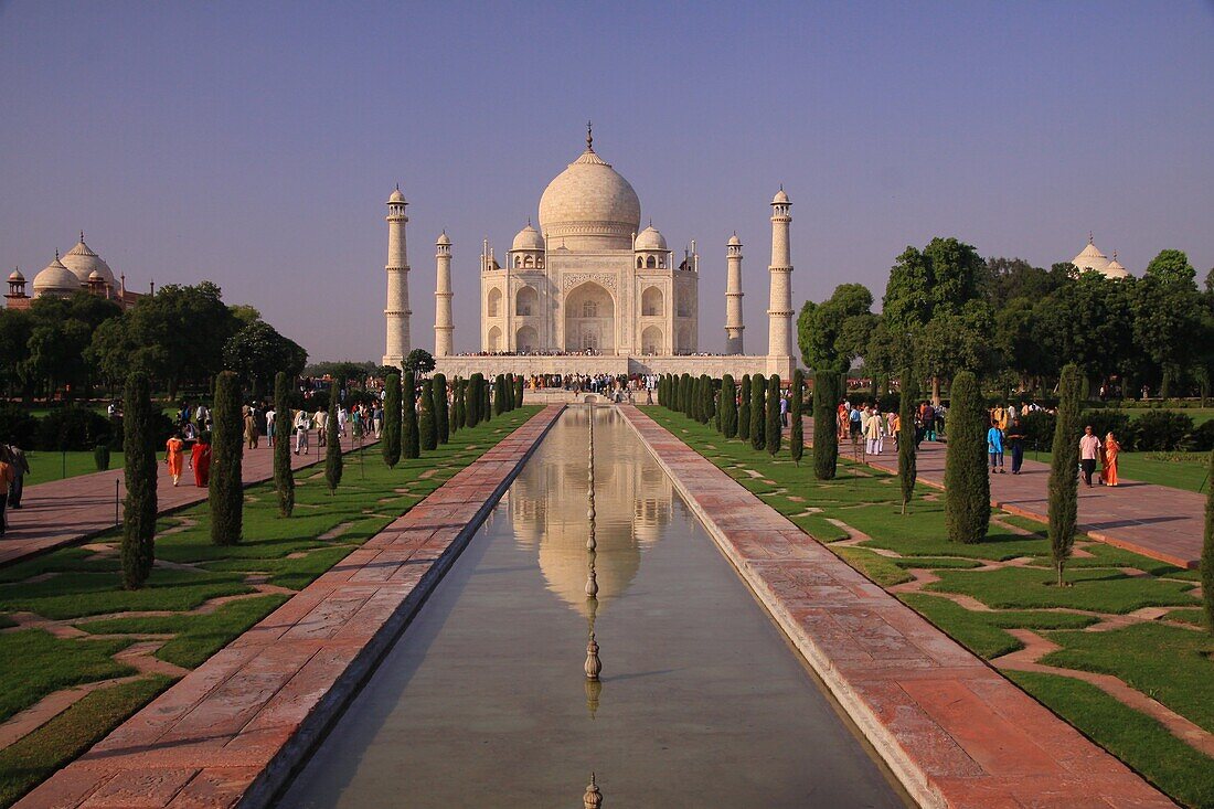 The reflection of the Taj Mahal in the reflction pool shows the aonderfully balanced design and symmetry of this world heritage site in Agra, India