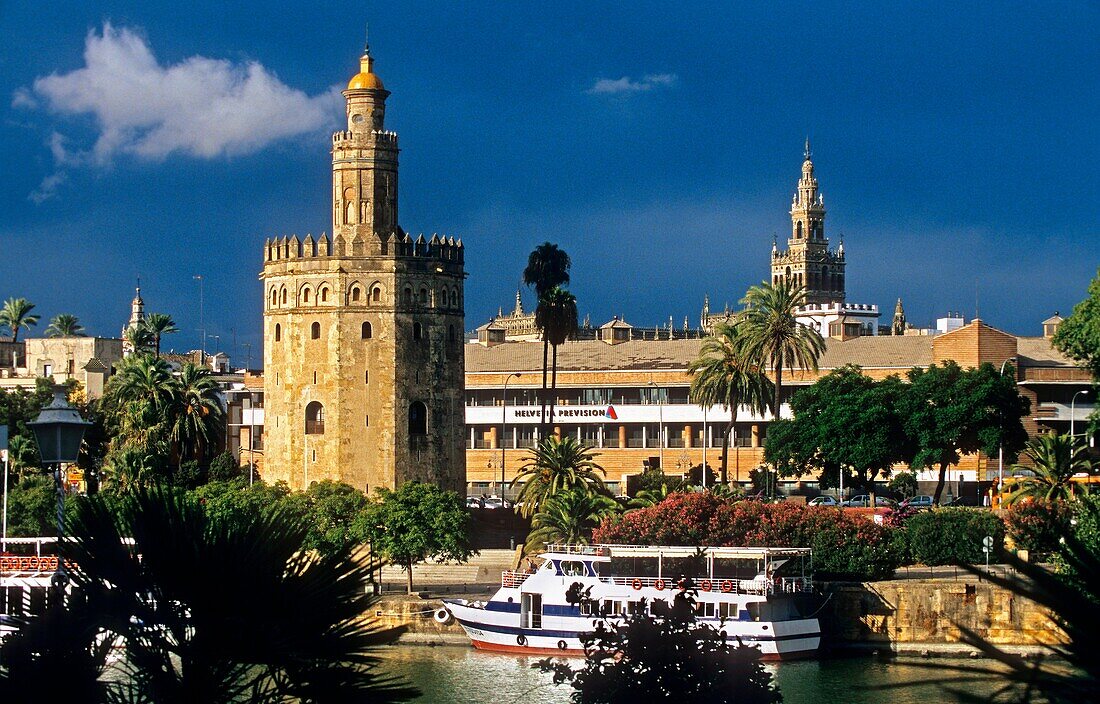 Sevilla: Gold tower and Giralda tower, as seen from Guadalquivir river