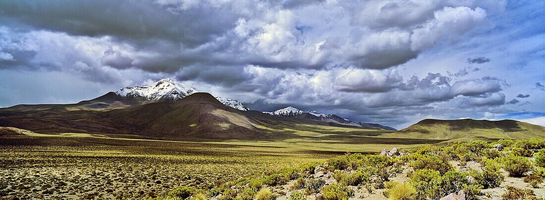 Thunderstorm clouds over the vulcano Isluga, part of Isluga National Park in the Altiplano of Chile  America, South America, Chile, Norte Grande, Altiplano, February 2003