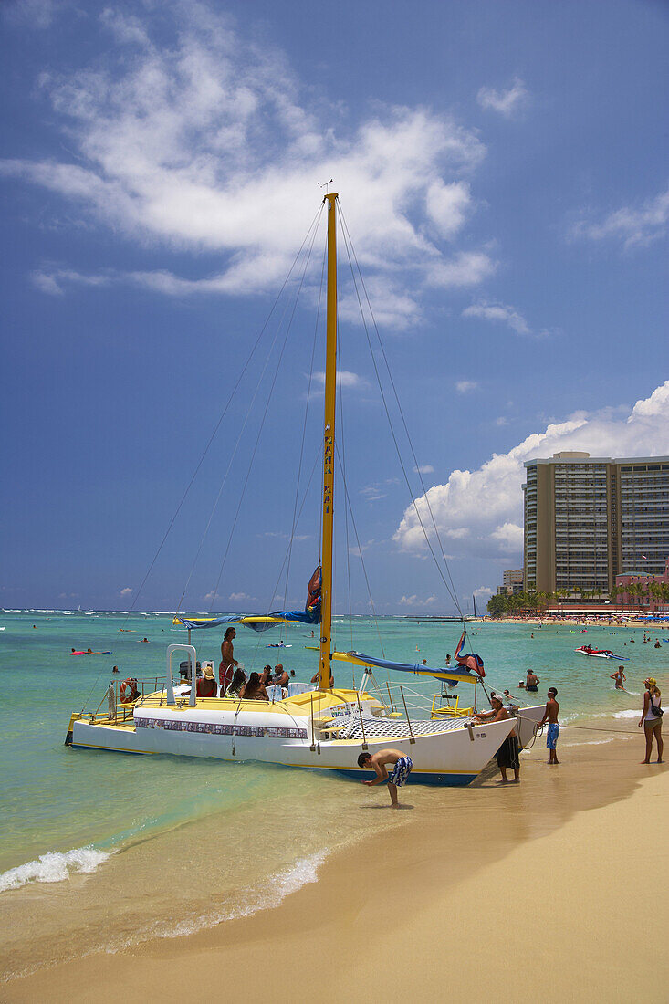 People and catamaran at Waikiki Beach, Honolulu, Oahu, Island, Hawaii, USA, America