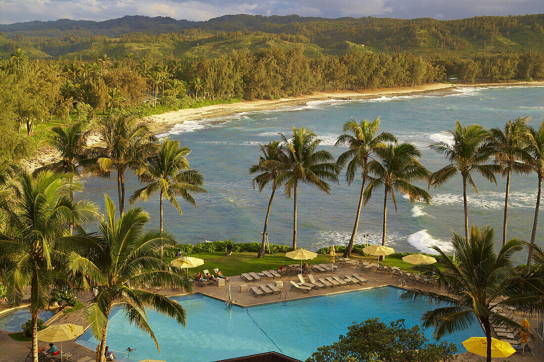 Pool under palm trees at the coast in the evening, North Shore, Turtle Bay, Oahu, Hawaii, USA, America