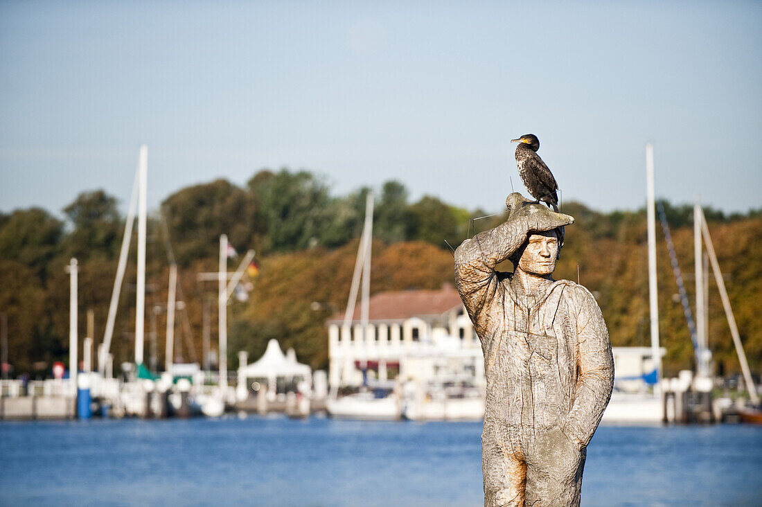 Statue in harbor, Travemunde, Lubeck, Schleswig-Holstein, Germany