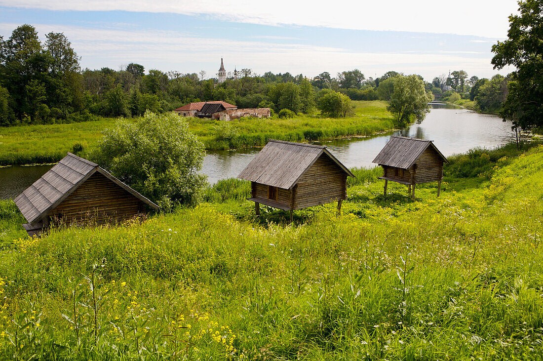 Russia. Suzdal. Kamenka River with boat huts built on stilts due to annual flooding.
