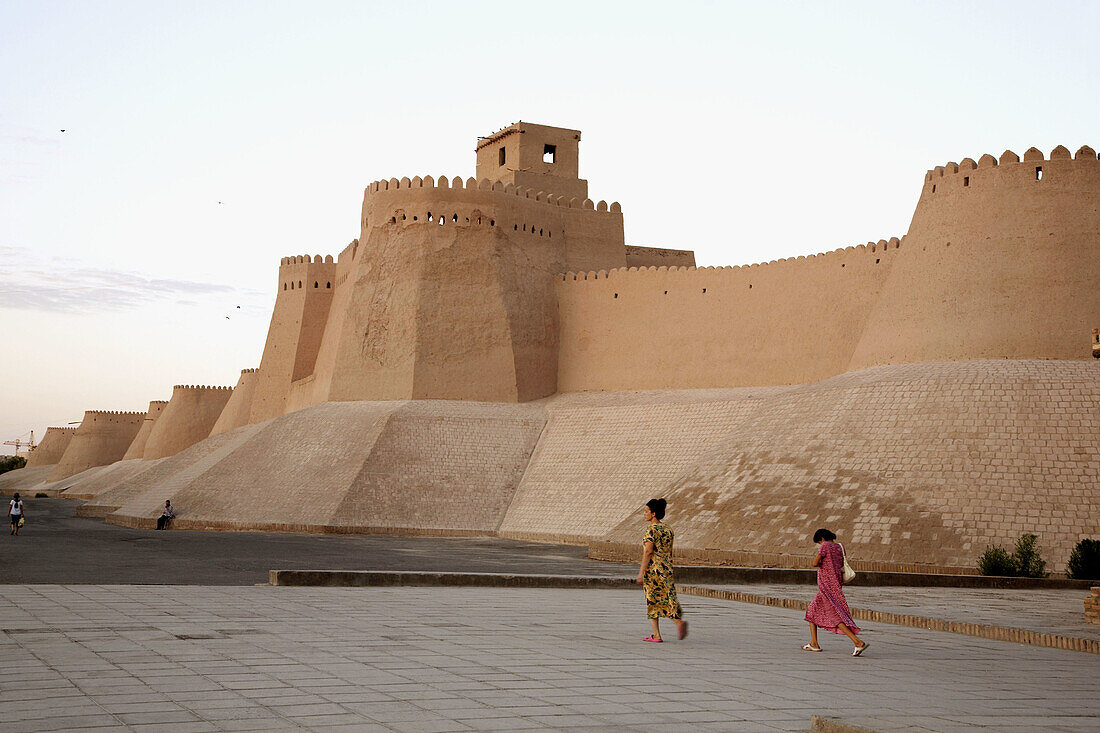 Adult, Adults, Architecture, Asia, cities, city, Color, Colour, Daytime, Ethnic, Ethnicity, exterior, female, Full body, Full length, Full-body, Full-length, Historic, Historical, History, Horizontal, human, Khiva, Khwarezm, outdoor, outdoors, outside, Pa