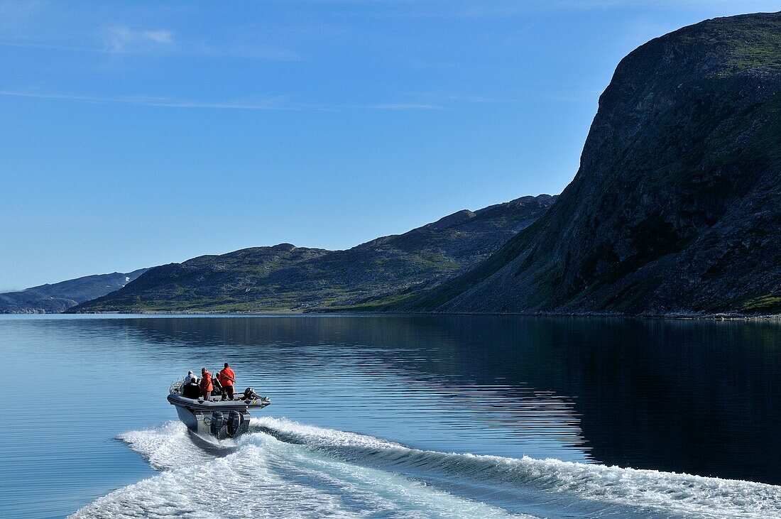 motorboat cruising through Saglek Fjord, Torngat Mountains National Park, Newfoundland and Labrador, Canada