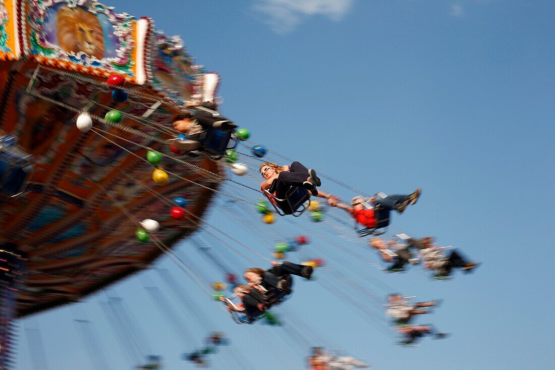 People on a fairground ride at a funfair