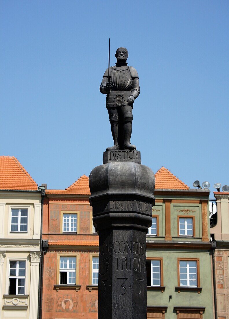 Man with sword statue on whipping post, Old Market Square, Poznan, Poland