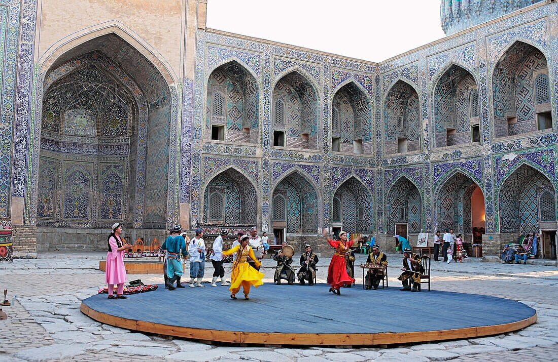 Uzbek folk show in the yard of Shyr Dor Madrasah, Registan Square, Samarkand, Uzbekistan