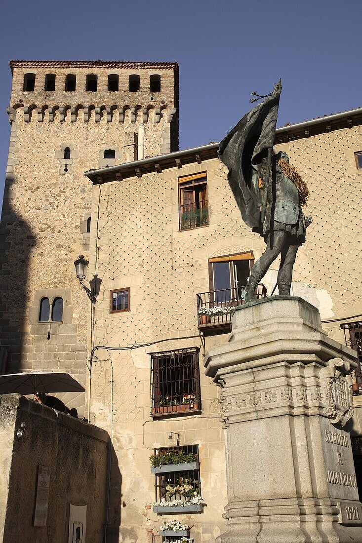 Plaza de San Martin Square with monument to Juan Bravo and the Torreon de Lozoya Building, Segovia, Spain