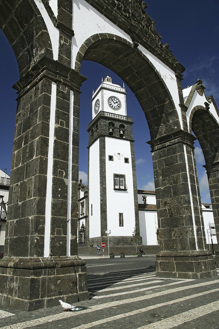 The city gates and the church tower, in downtown Ponta Delgada  Azores, Portugal