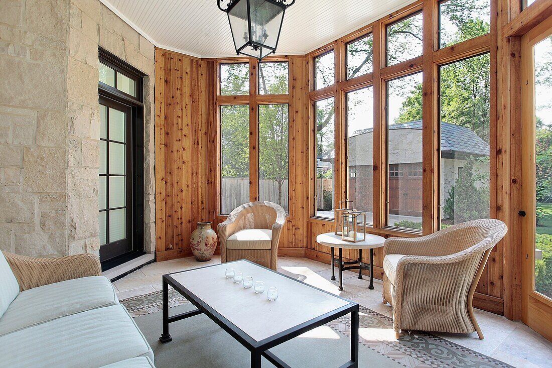 Porch in luxury home with stone wall