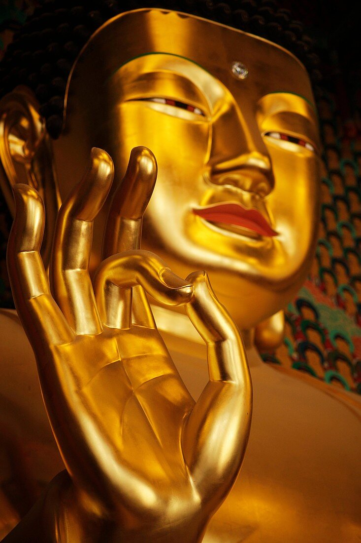golden buddha inside the buddhist temple Jogyesa in South Koreas Capital Seoul, Asia