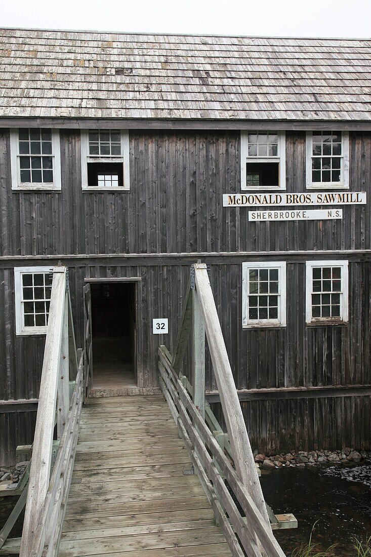 bridge and entrance at the historic McDonald Brother's Sawmill at Sherbrooke Village Museum Nova Scotia Canada.