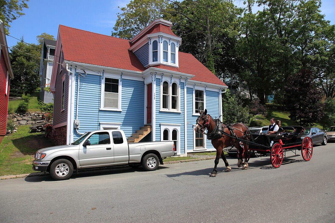 street scene with carriage at UNESCO World Heritage Site city of Lunenburg, Nova Scotia, Canada, North America
