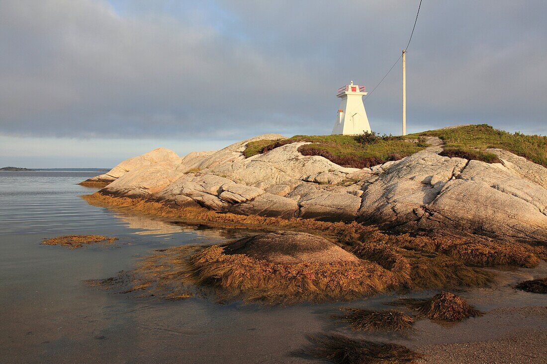 lighthouse on the rocky Atlantic coast at Terence Bay, Nova Scotia, Canada, North America.