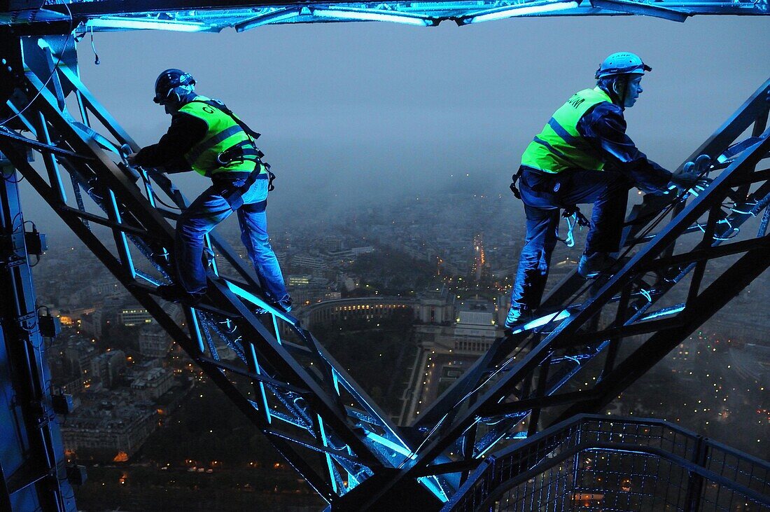 Electricians working at the top floor of the Eiffel Tower, Paris, France