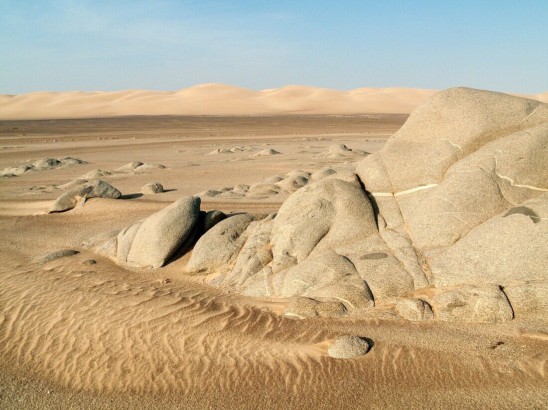 Namibia - Grey-white rocks and sand dunes in the Namib Desert at Torra Bay Skeleton Coast Park, Namibia
