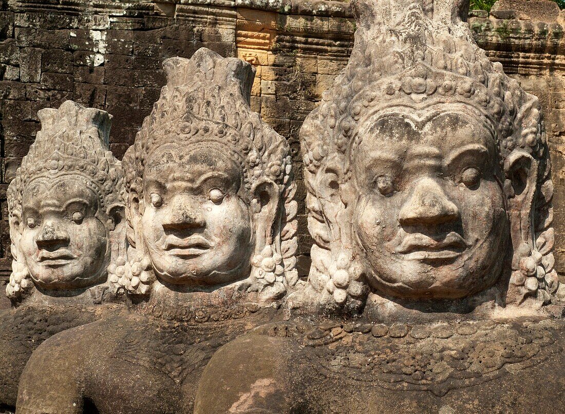 Cambodia - Row of demons along the access road to the South Gate of Angkor Thom, theGreat Capital,  of the Khmer empire in Angkor The temple complexes of Angkorcity,  were the heart of the Khmer empire which flourished from the 9th to the 13th century