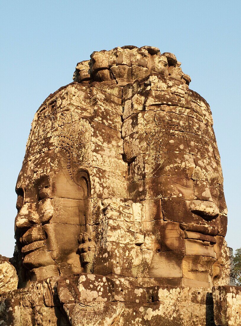 Cambodia - A Prasat pyramid tower with the faces of LokeshvaraLord of the World,  in the Bayon, a temple in the centre of Angkor Thom, theGreat Capital,  of the Khmer empire in Angkor The temple complexes of Angkorcity,  were the heart of the Khmer em