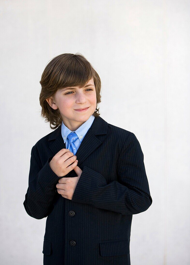 blue eyes, boy, brown hair, Caucasian ethnicity, chestnut hair, child, childhood, clipping path, Color image, contemporary, dressed up, elegance, elegant, gesture, human, infancy, kid, Male, necktie, one, one person, people, pre-teen, smile, stand, standi