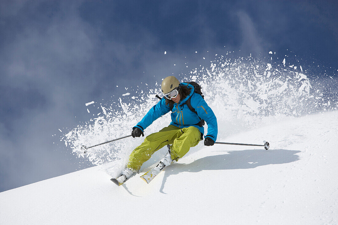 Skier in deep powder snow, Disentis, Oberalp pass, Canton of Grisons, Switzerland