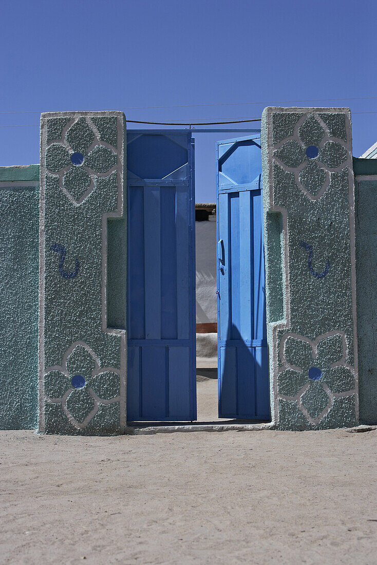 Blue gate in the sunlight, Sudan, Africa