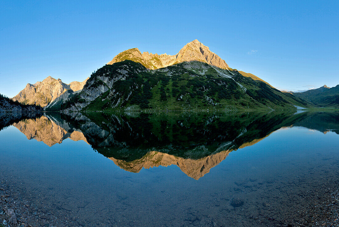 Mountain lake with reflection, lake Tappenkarsee, Salzburger Land, Austria