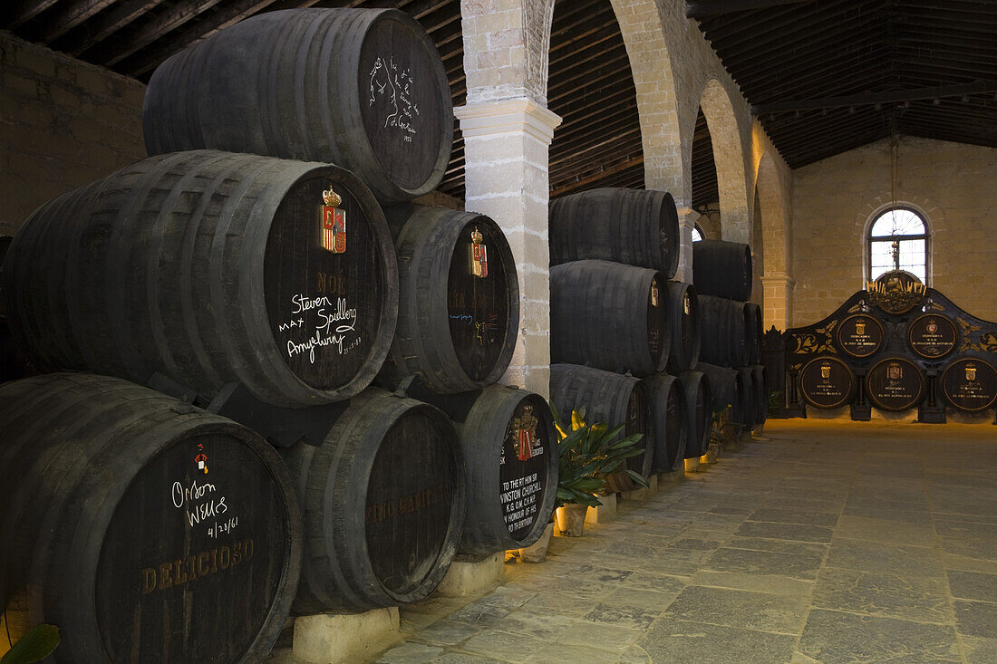 Famous people sherry casks in cellar of Bodega Tio Pepe Gonzales Byass winery, Jerez de la Frontera, Andalucia, Spain, Europe