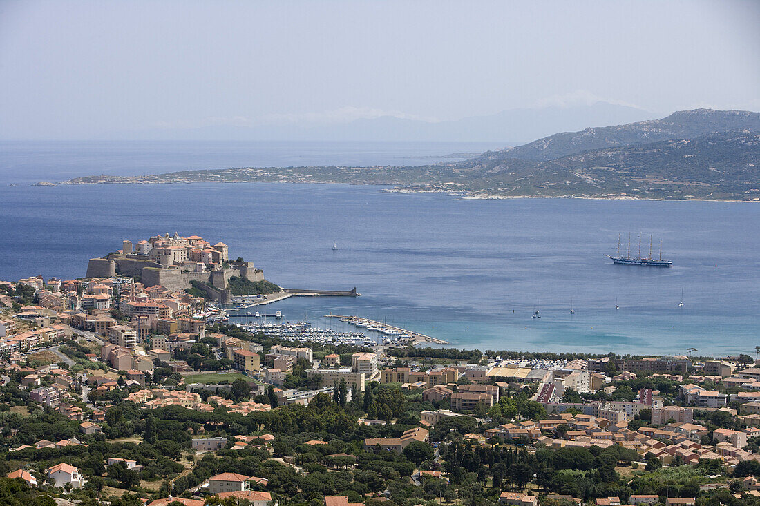 View at the town of Calvi with citadel and sailing cruiseship Royal Clipper, Calvi, Corsica, France, Europe