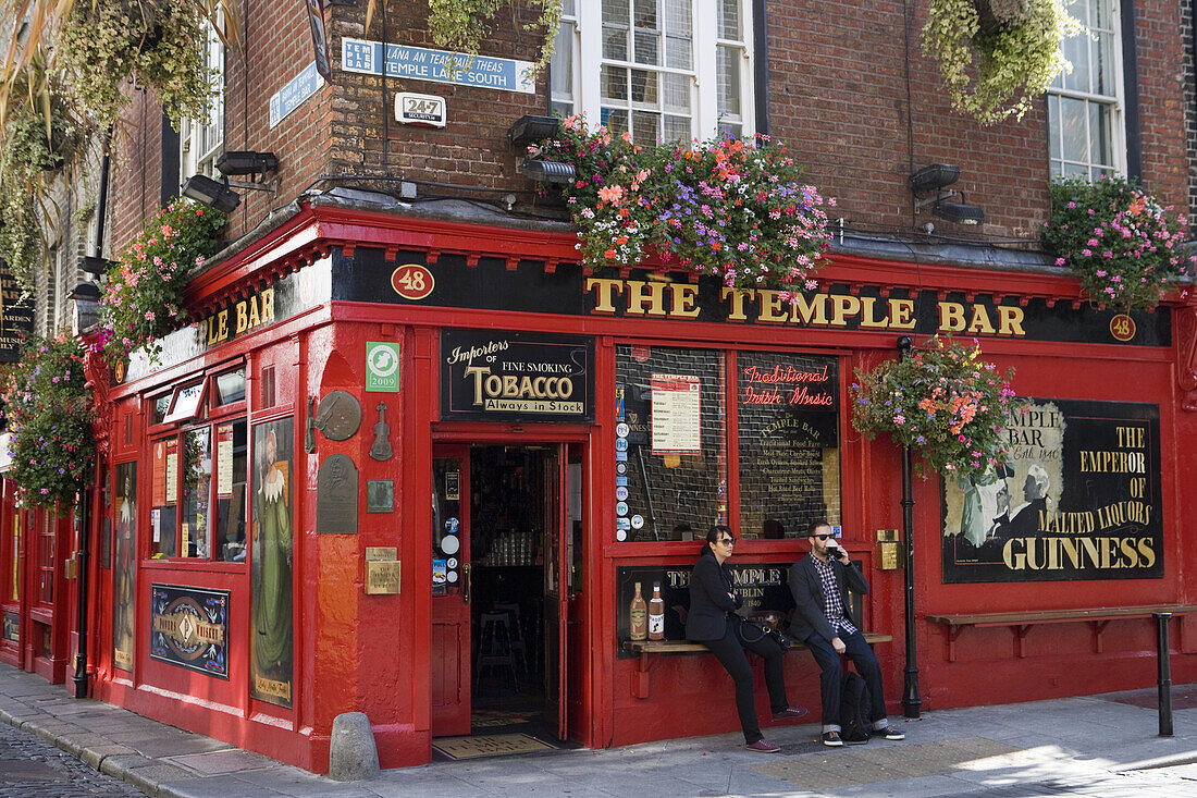 People enjoying their Guinness outside The Temple Bar at Temple Bar district, Dublin, County Dublin, Leinster, Ireland, Europe