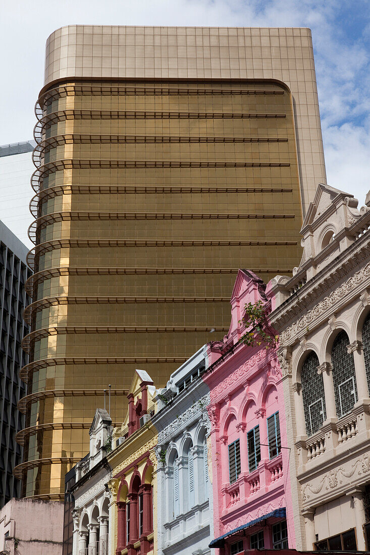 Historical colonial houses in front of a modern business builing, Kuala Lumpur, Malaysia, Asia