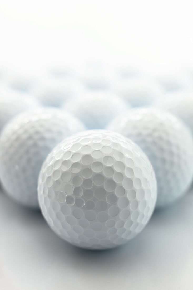 Many golf balls in a still life arrangement