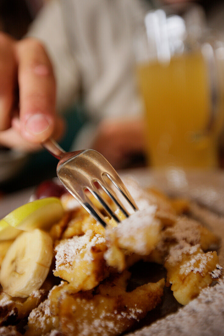 Man eating Kaiserschmarrn, Mayrhofen, Ziller Valley, Tyrol, Austria