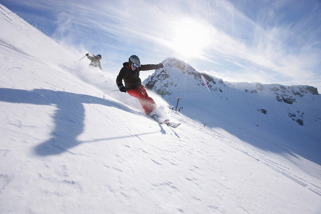 Skiers downhill skiing at Blackcomb Peak, British Columbia, Canada