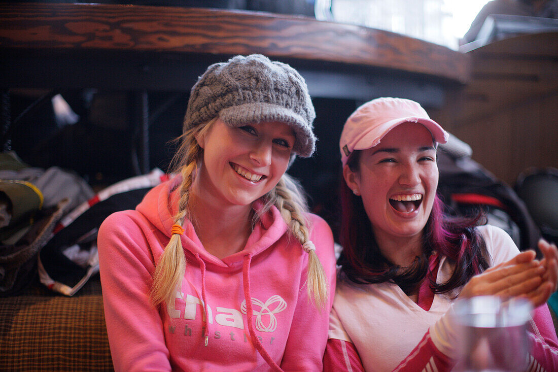 Two women laughing, Apres-ski bar, Whistler, British Columbia, Canada