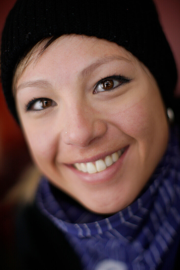 Female free skier smiling at camera, British Columbia, Canada