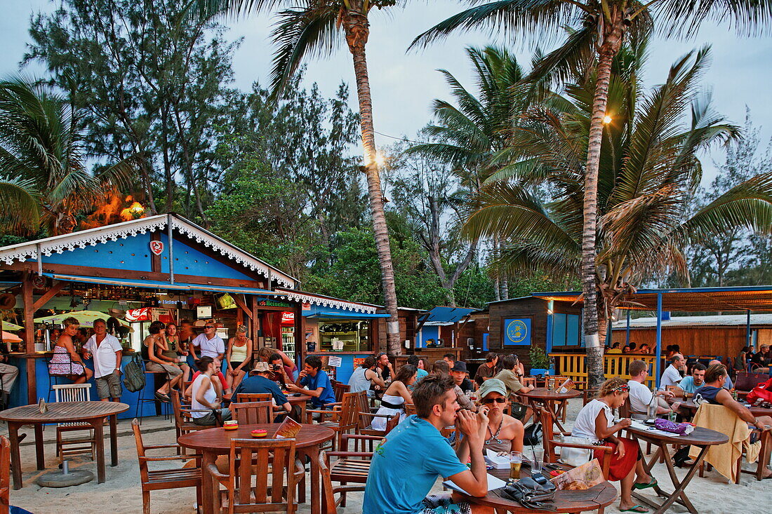 People in one of Saint Gilles beach bars in the evening, La Reunion, Indian Ocean