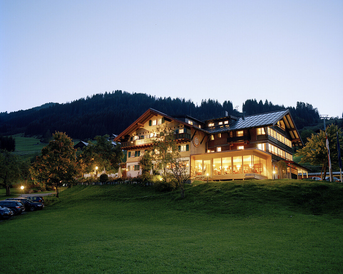 Exterior view of organic Hotel Chesa Valisa in the evening light, Hirschegg, Kleinwalsertal, Austria