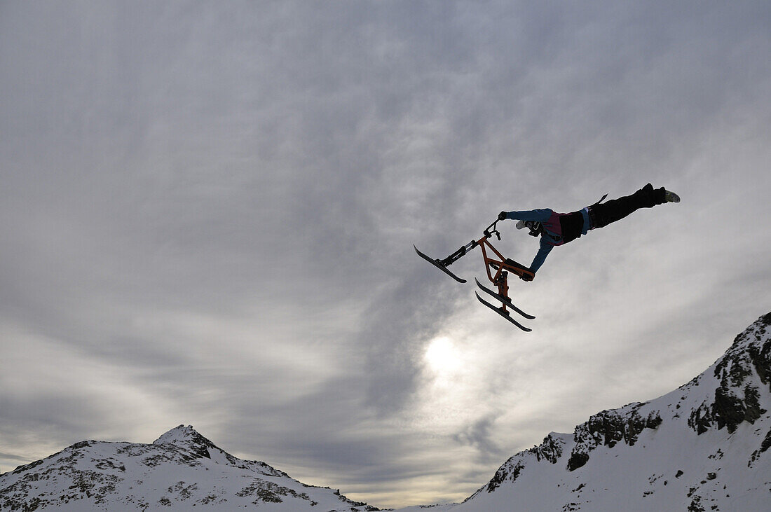Ski bob artist during jump, Stubai glacier, Stubai Alps, Tyrol, Austria, Europe