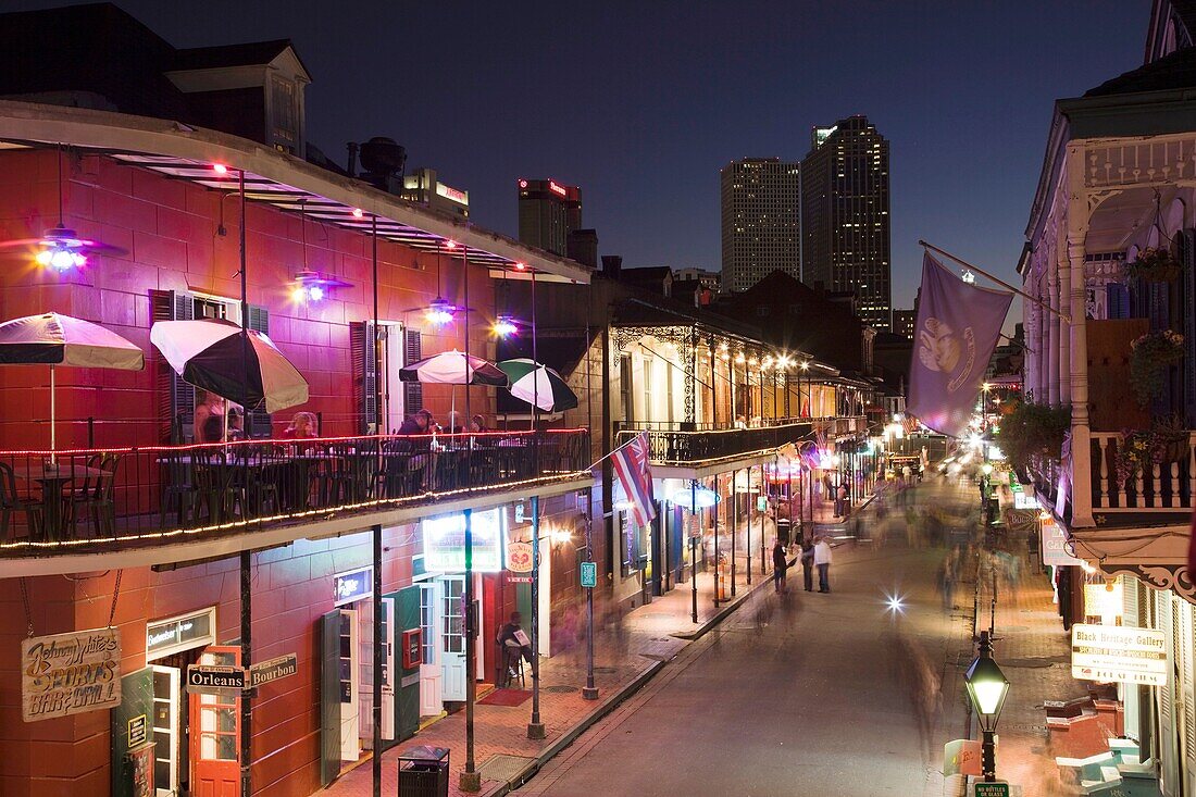 USA, Louisiana, New Orleans, French Quarter, Bourbon Street and city skyline, elevated view, dusk