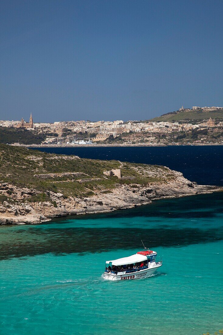 Malta, Comino Island, The Blue Lagoon with tour boat