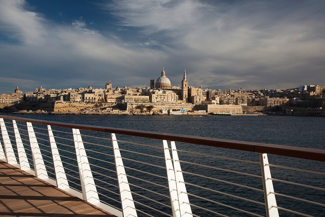 Malta, Valletta, skyline with St Paul's Anglican Cathedral and Carmelite Church from Sliema, sunset