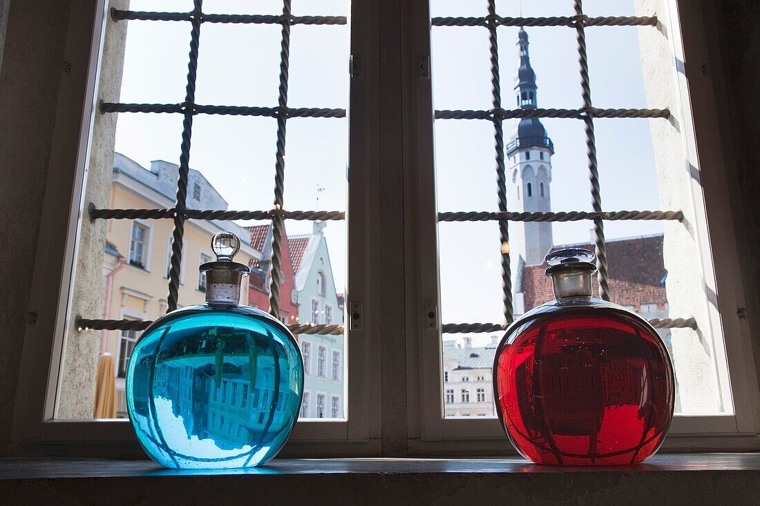 Estonia, Tallinn, Old Town, Raekoja Plats, Town Hall Square, Town Council Pharmacy, b 1422, colored liquid in window overlooking town hall