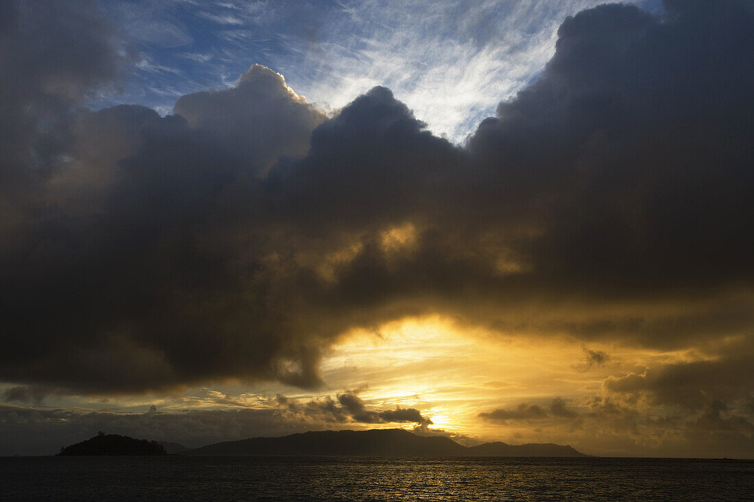 Sunrise sky over La Digue island, Baie St. Anne, Praslin island, Seychelles