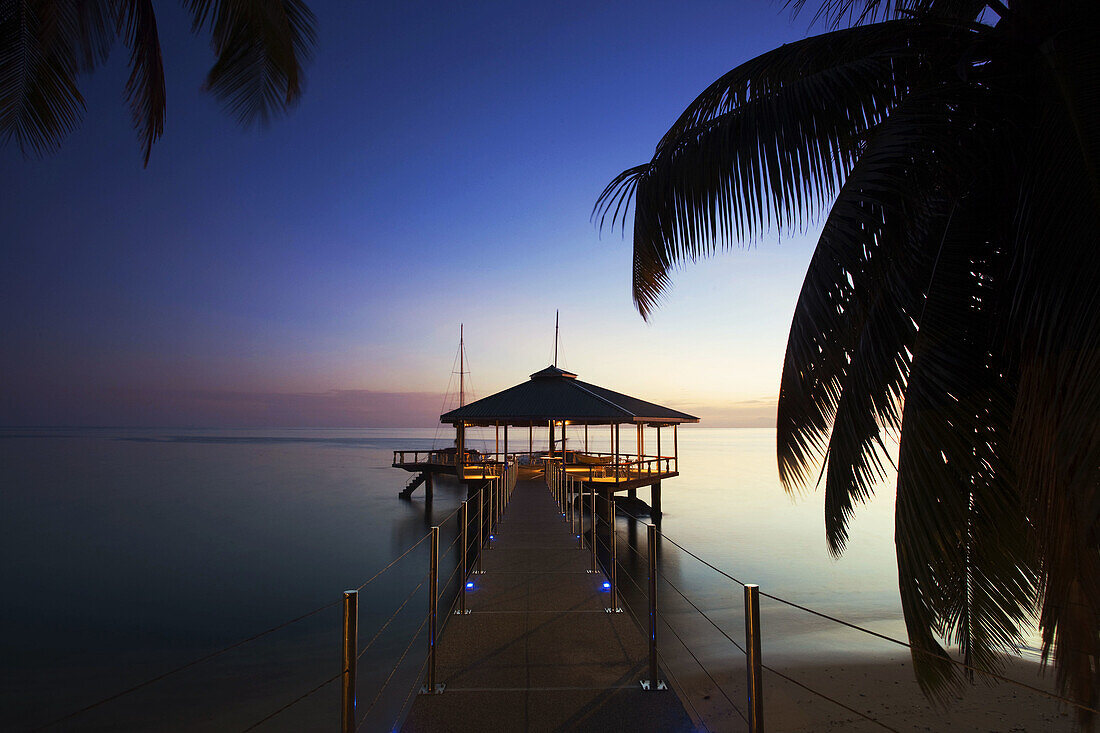 Pier at Coco de Mer Hotel at sunset, Anse Bios de Rose, Praslin island, Seychelles