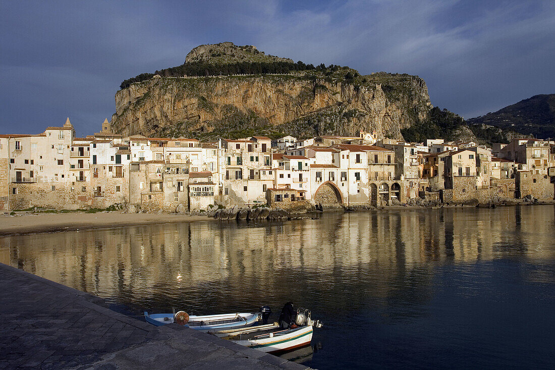 Old port Mt. La Rocca fishing boats vessels beach Moorish architecture Town of Cefalu Palermo Province Sicily Italy