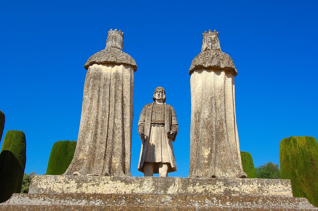 Statues of the Catholic Monarchs (Queen Isabella I of Castile and King Ferdinand II of Aragon) and Christopher Columbus in the Alcazar of the Christian Kings gardens, Cordoba. Andalusia, Spain