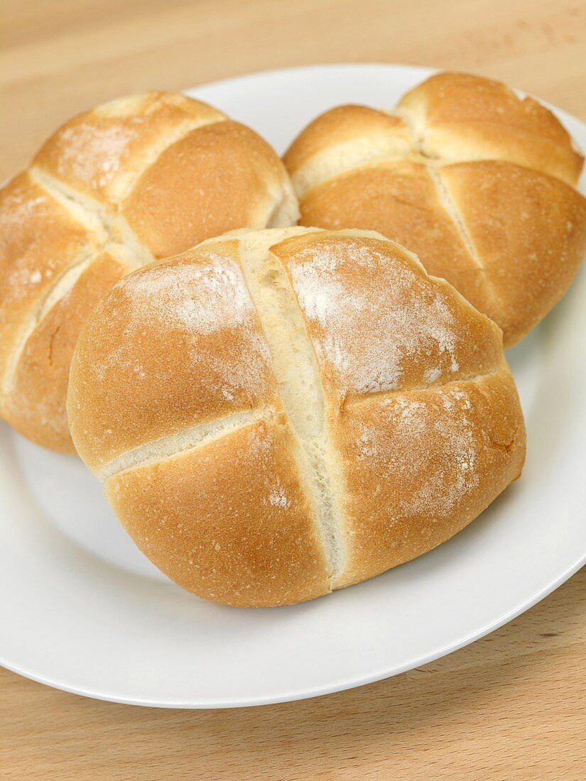 Fresh bread rolls isolated on a kitchen bench